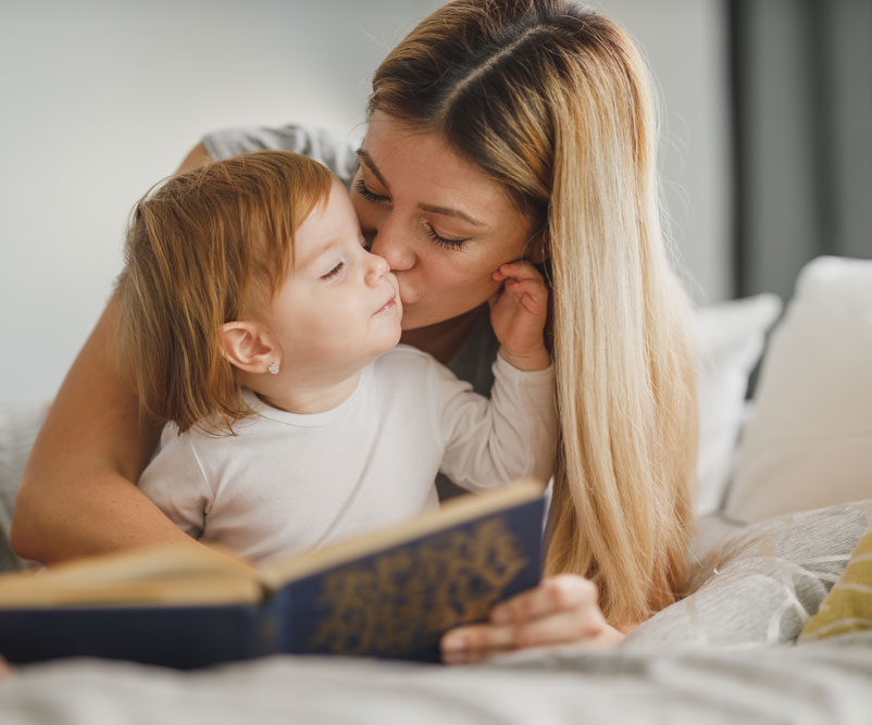Professional woman managing working mom guilt while parenting
